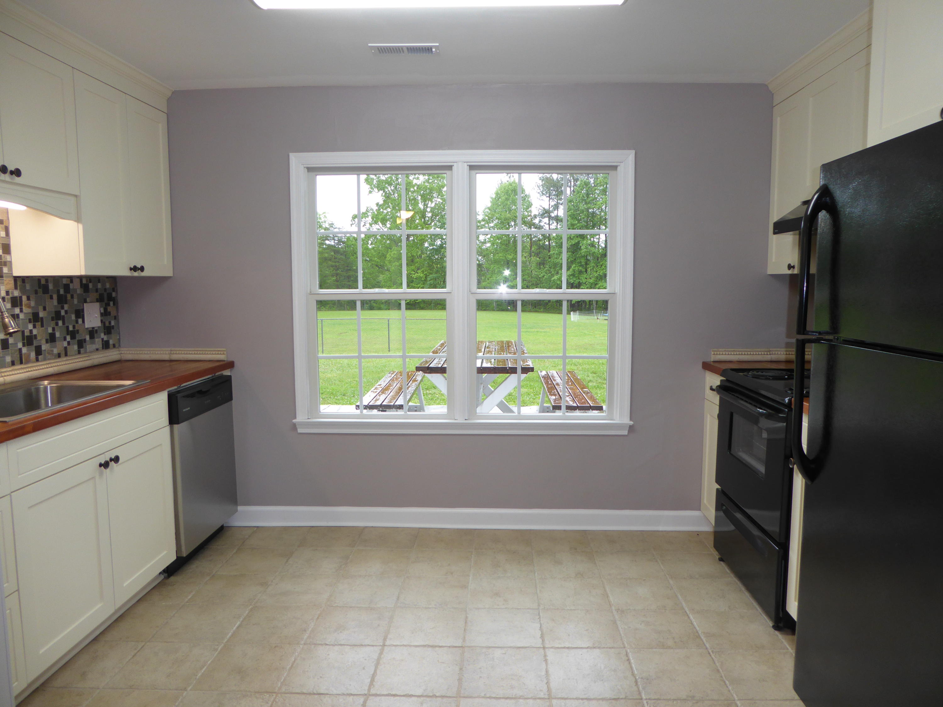 7740 Edwardsville Road Hardy, VA 24101 - Photo 26 of 92 a kitchen with a refrigerator a stove a sink and a window