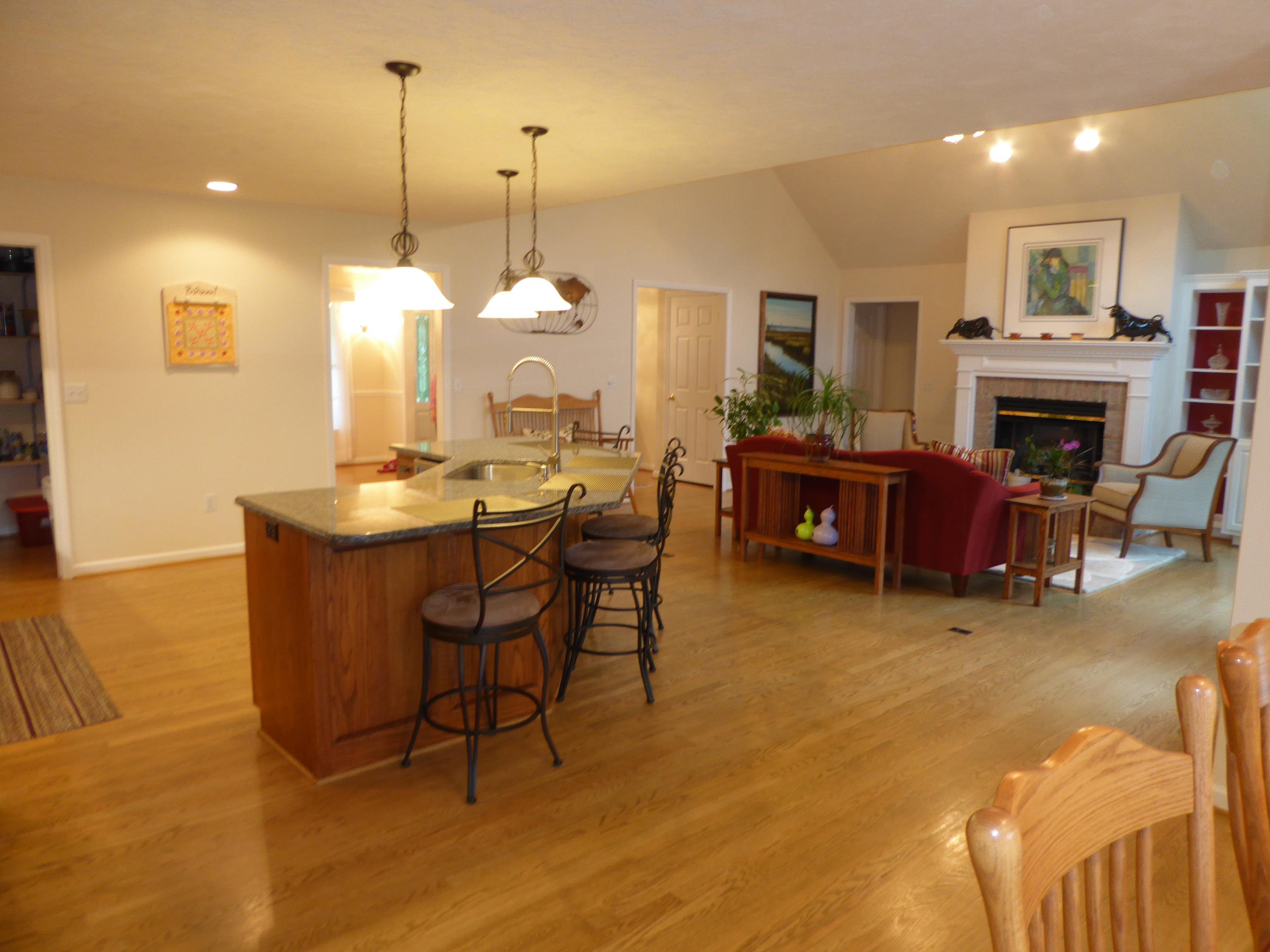 7740 Edwardsville Road Hardy, VA 24101 - Photo 4 of 92 a living room with furniture a fireplace and a chandelier