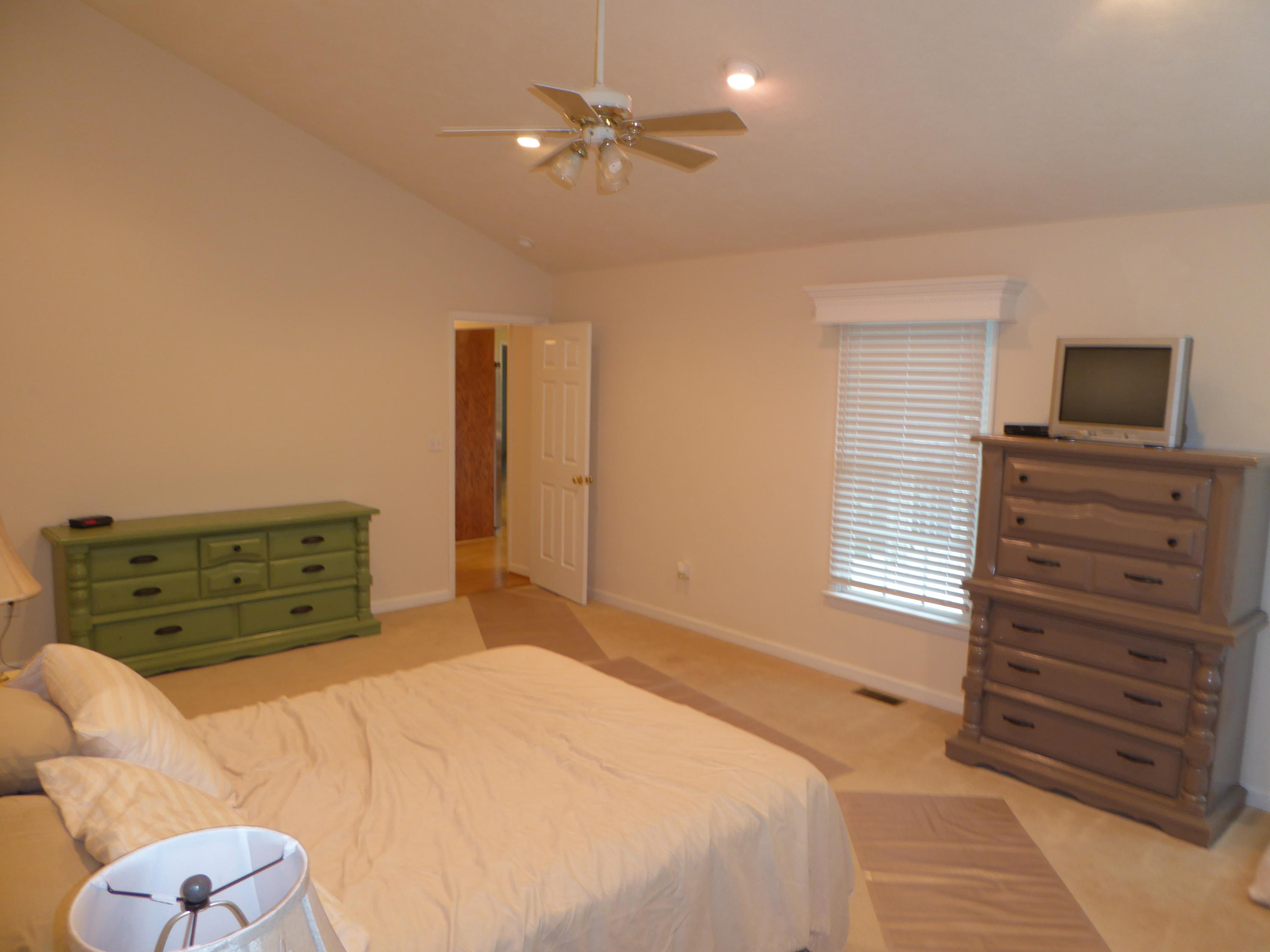 7740 Edwardsville Road Hardy, VA 24101 - Photo 48 of 92 a bedroom with a bed and a chandelier