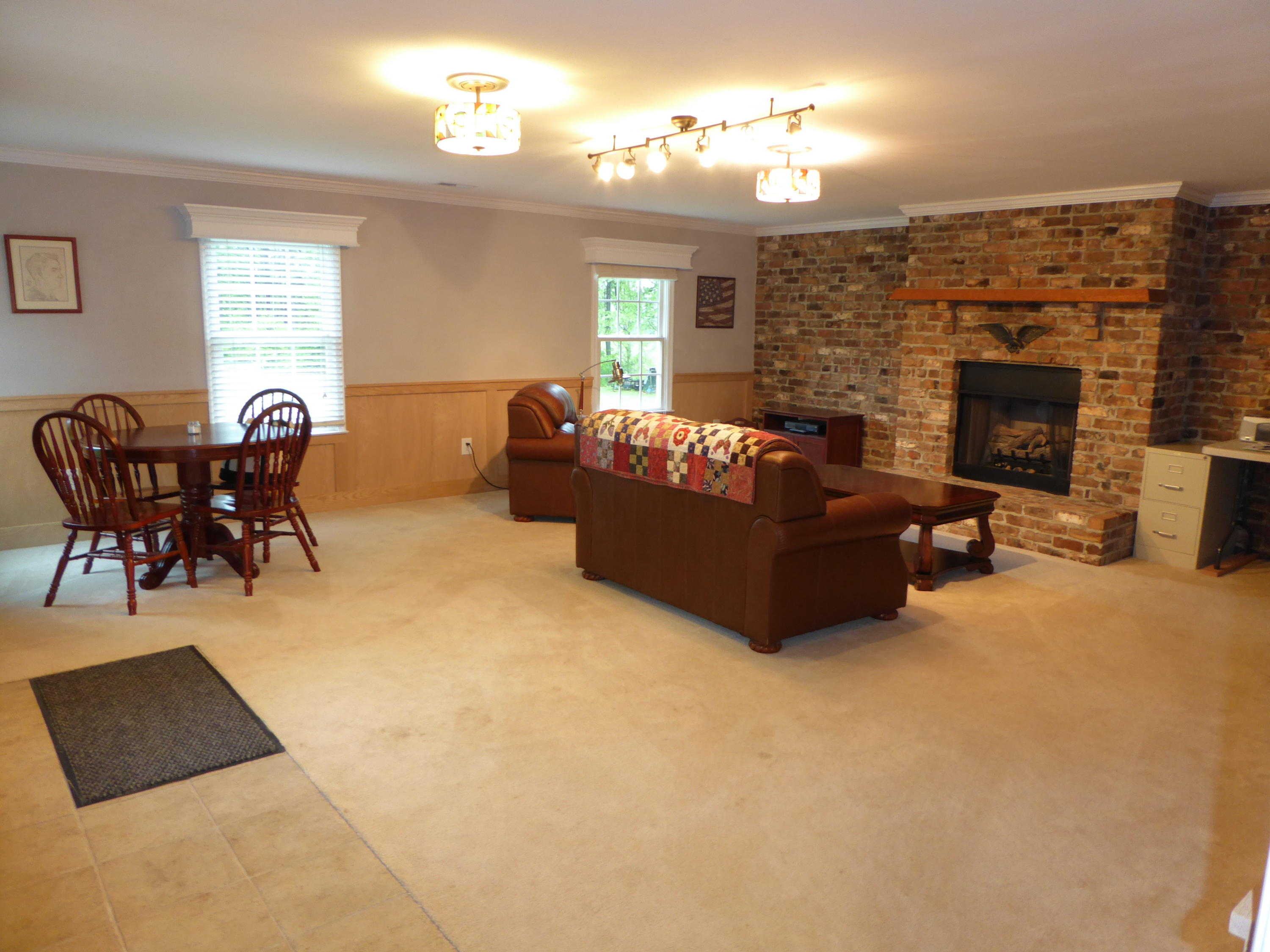 7740 Edwardsville Road Hardy, VA 24101 - Photo 60 of 92 a living room with furniture a fireplace and a window