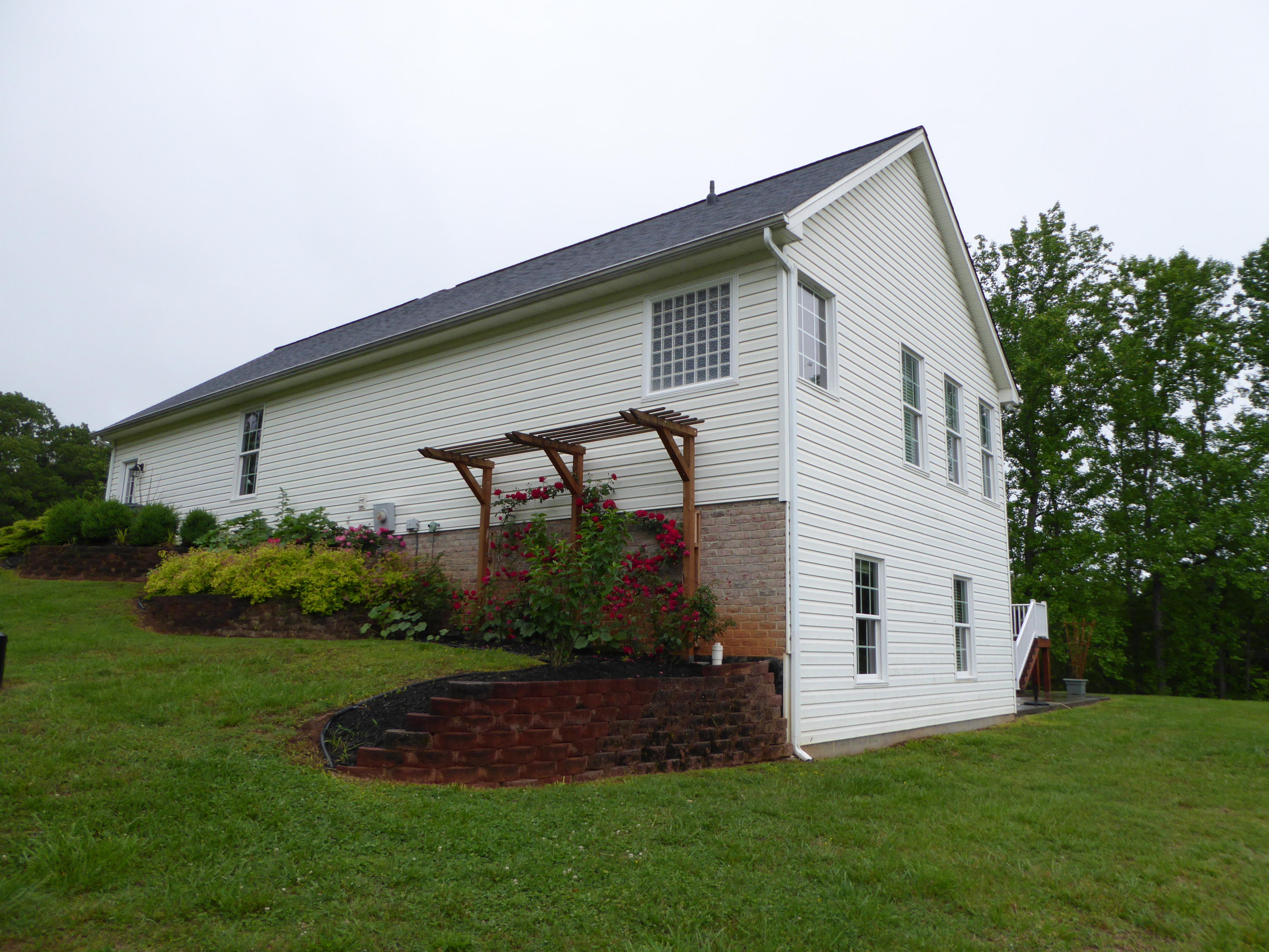 7740 Edwardsville Road Hardy, VA 24101 - Photo 75 of 92 a front view of house with garden