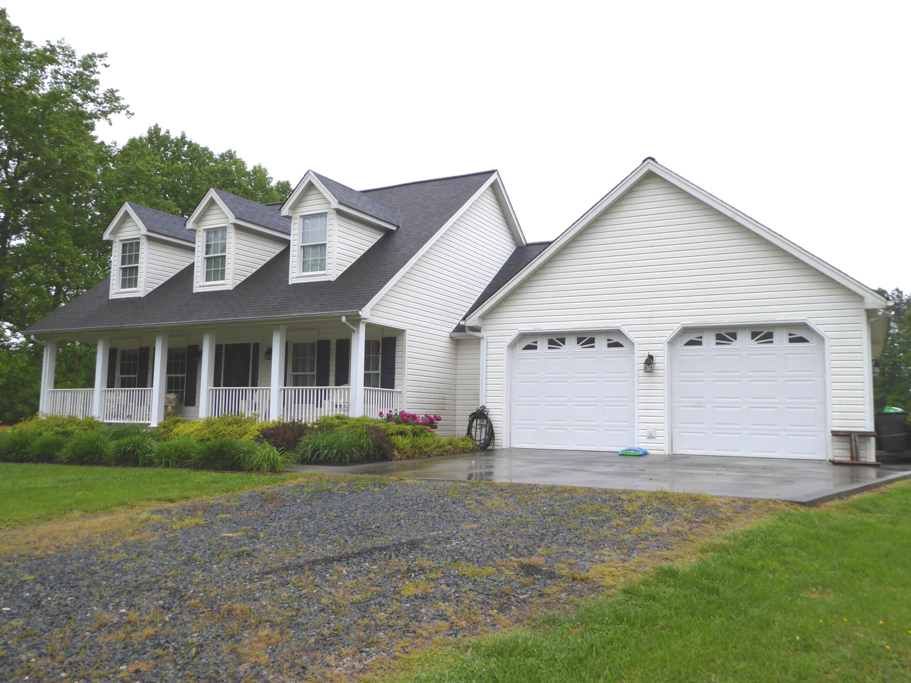 7740 Edwardsville Road Hardy, VA 24101 - Photo 87 of 92 a view of a house with a yard and plants