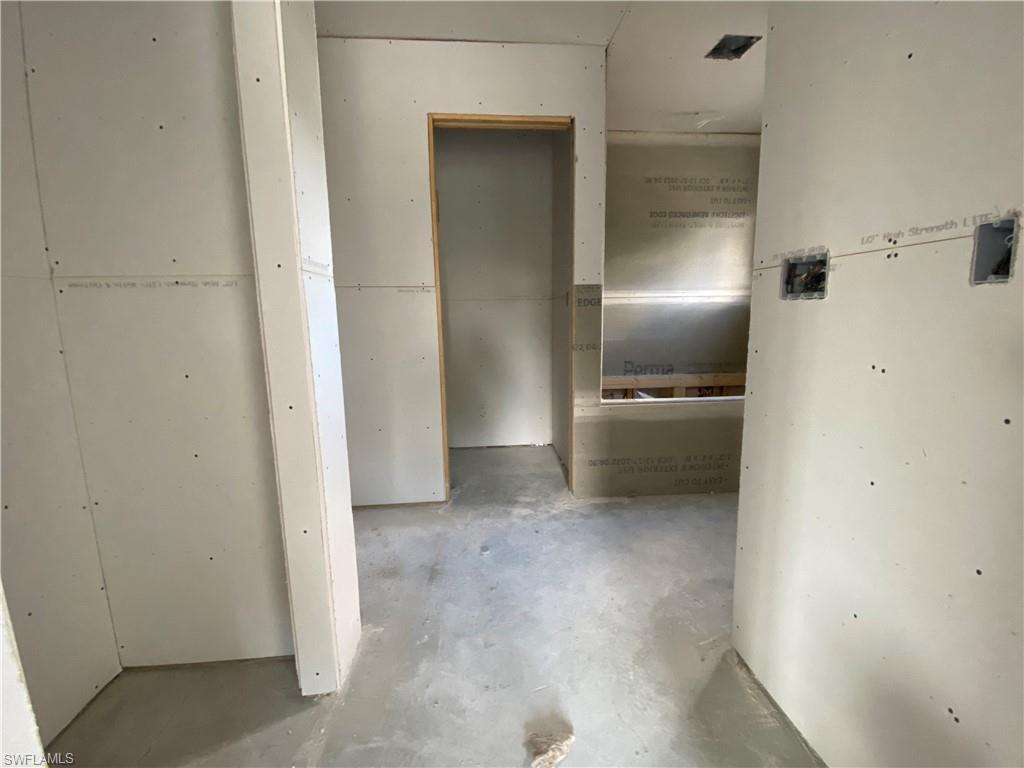 3317 7th Street Southwest Lehigh Acres, FL 33976 - Photo 11 of 23 a view of a refrigerator in a kitchen