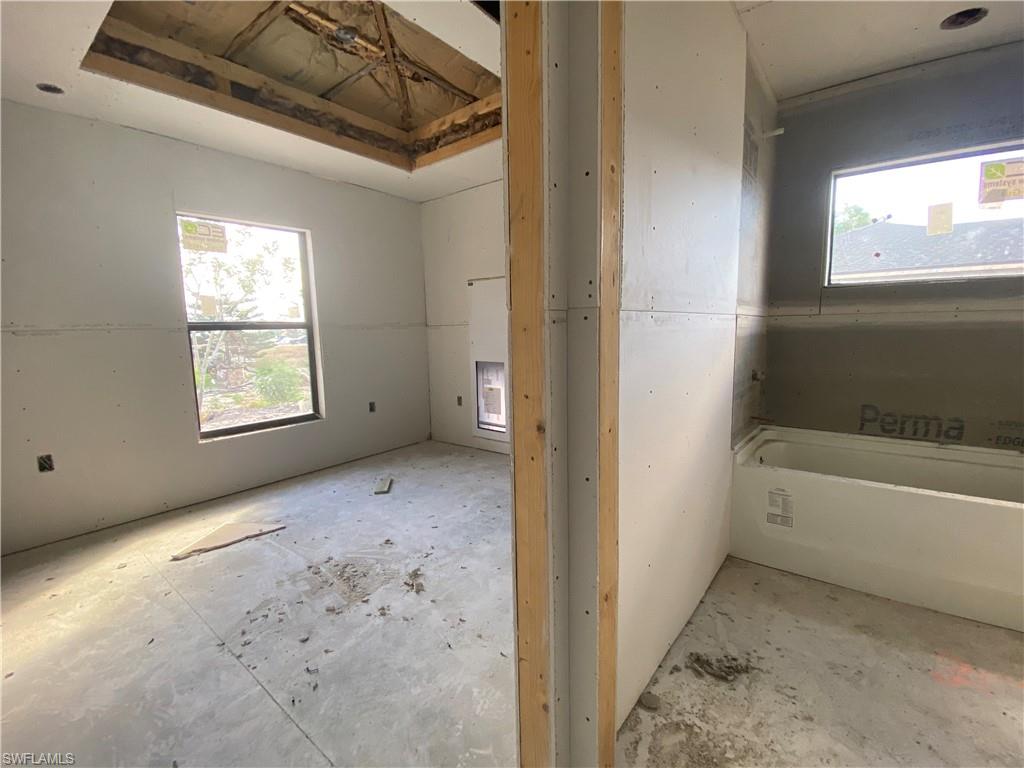 3317 7th Street Southwest Lehigh Acres, FL 33976 - Photo 5 of 23 a view of a bathtub & utility room in a bathroom