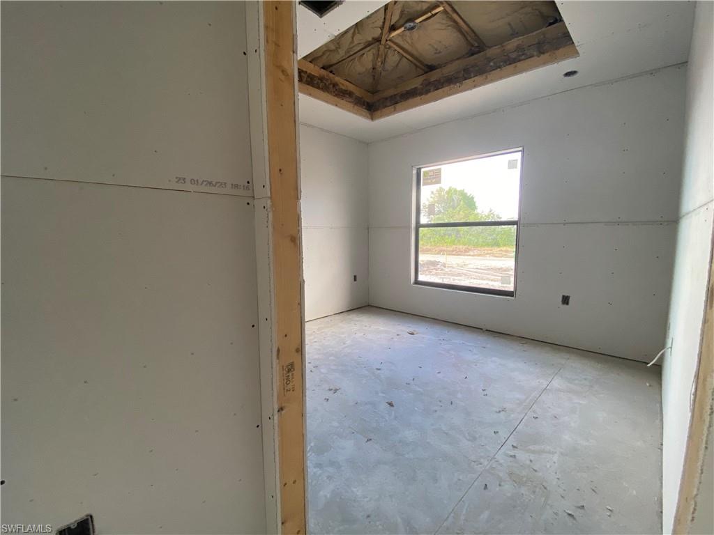 3317 7th Street Southwest Lehigh Acres, FL 33976 - Photo 6 of 23 a view of an empty room with a window