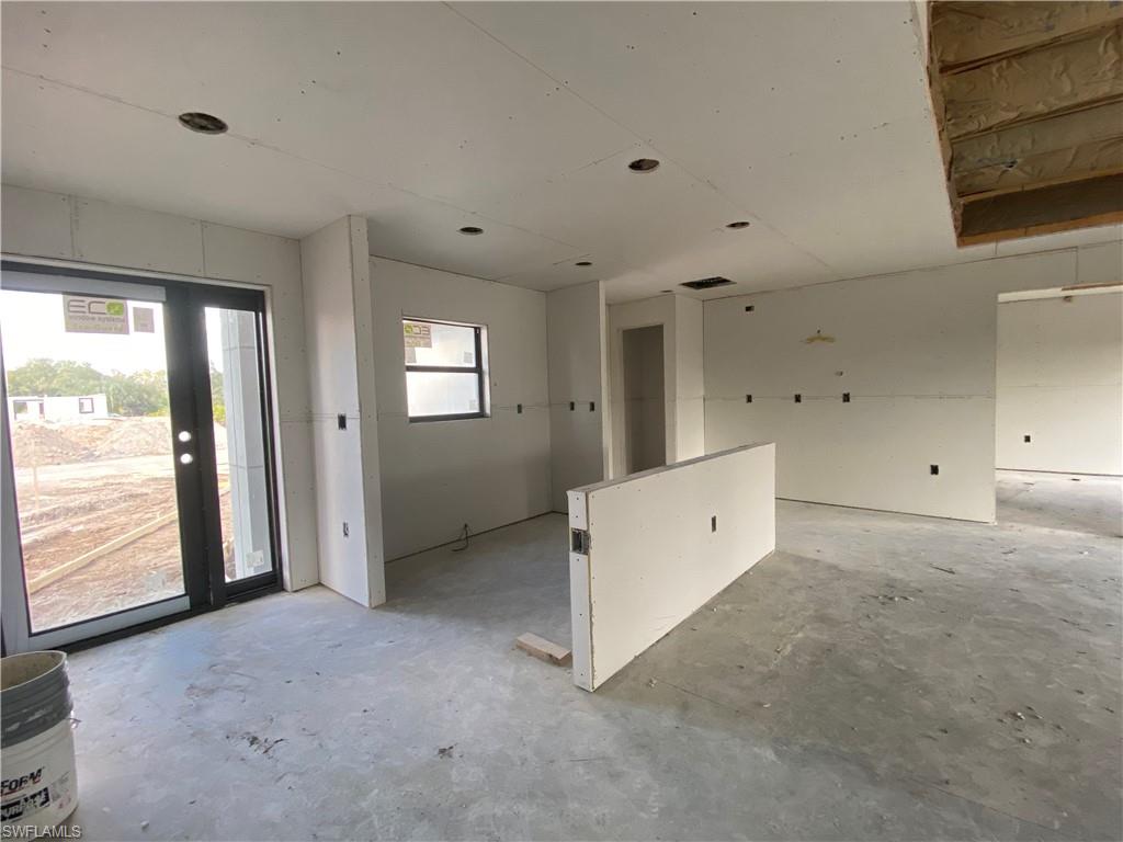 3317 7th Street Southwest Lehigh Acres, FL 33976 - Photo 7 of 23 a view of an empty room with a window