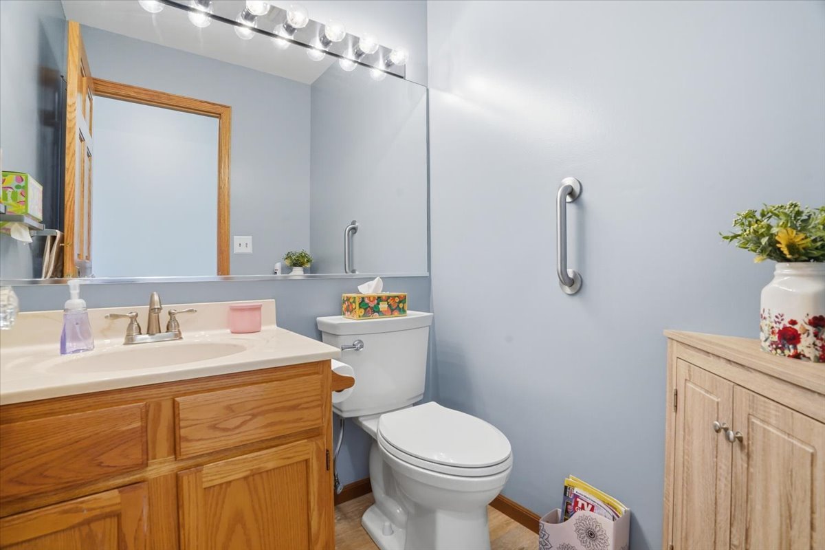 3413 Harbor Ridge Drive Zion, IL 60099 - Photo 18 of 37 a bathroom with a sink vanity mirror and toilet