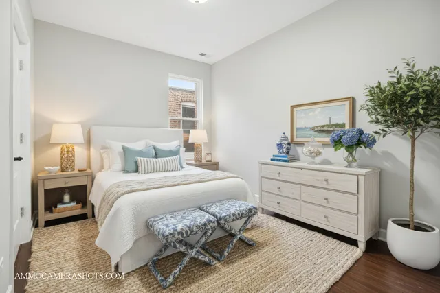 a bedroom with a bed and a dresser