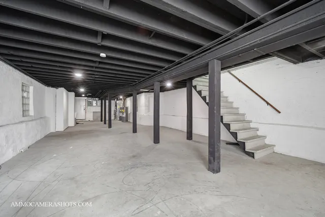 a view of an empty room with stairs