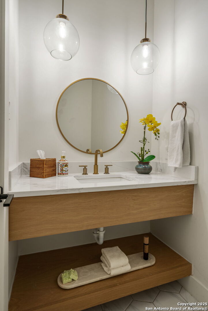 384 Blue Diamond Boerne, TX 78006 - Photo 19 of 51 a bathroom with a sink and a mirror