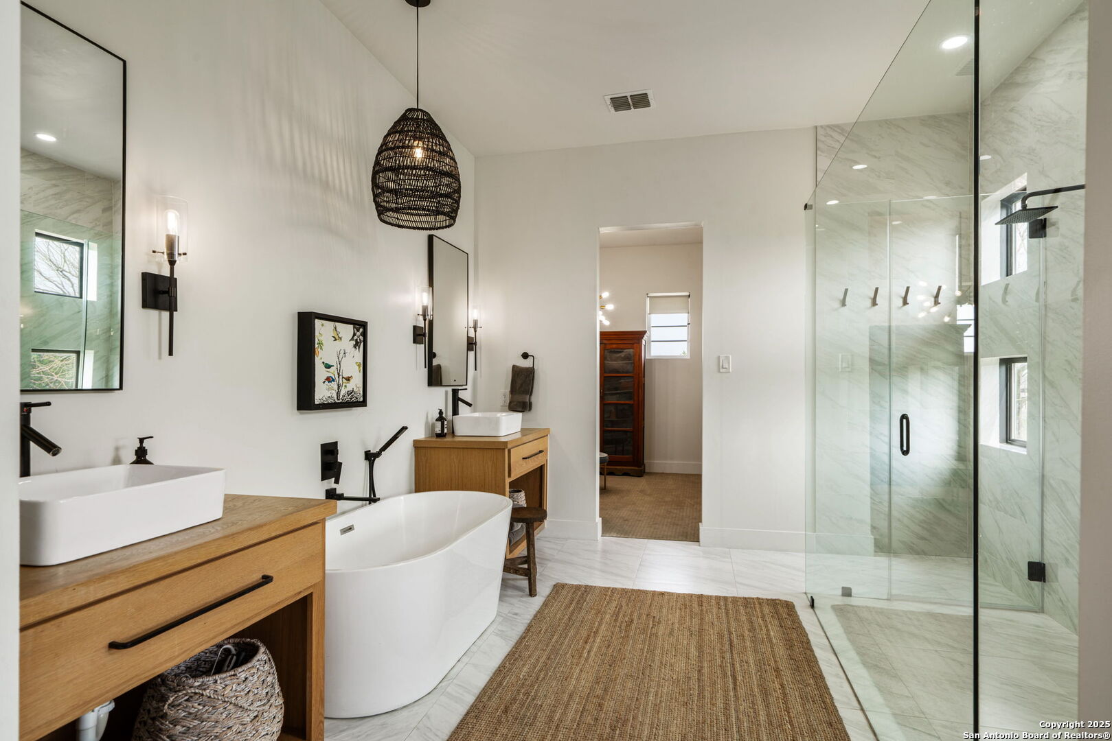 384 Blue Diamond Boerne, TX 78006 - Photo 23 of 51 a bathroom with a sink a mirror a bathtub and shower