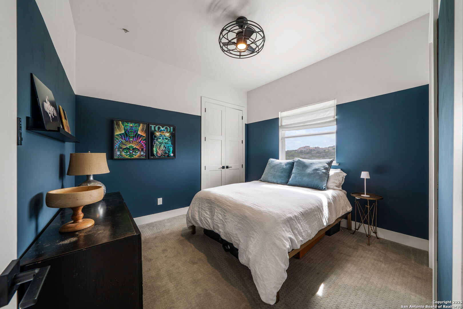 384 Blue Diamond Boerne, TX 78006 - Photo 29 of 51 a bedroom with a bed and a chandelier