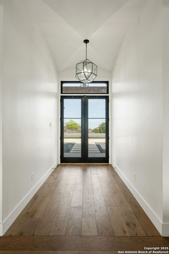 384 Blue Diamond Boerne, TX 78006 - Photo 4 of 51 a view of a room with wooden floor and windows