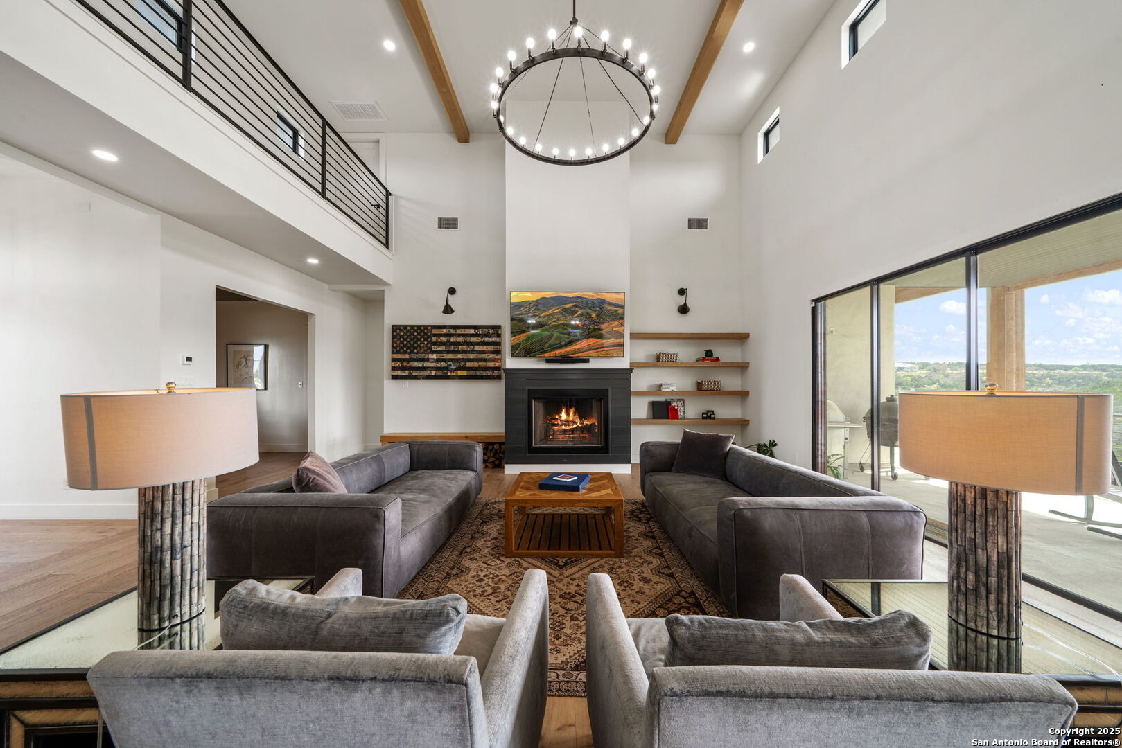 384 Blue Diamond Boerne, TX 78006 - Photo 6 of 51 a living room with furniture a large window and a chandelier