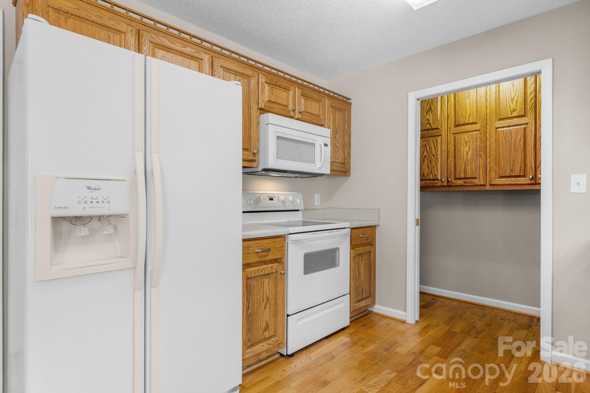 4967 Addison Lane Hickory, NC 28601 - Photo 11 of 43 a kitchen with stainless steel appliances granite countertop a sink and a refrigerator