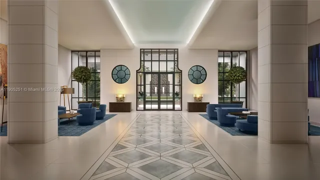 a living room with couches a large mirror with wooden floor