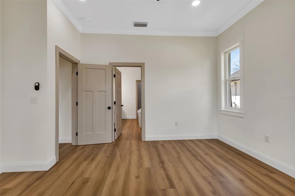 2444 Jacobs Street Port Charlotte, FL 33953 - Photo 27 of 52 wooden floor in an empty room