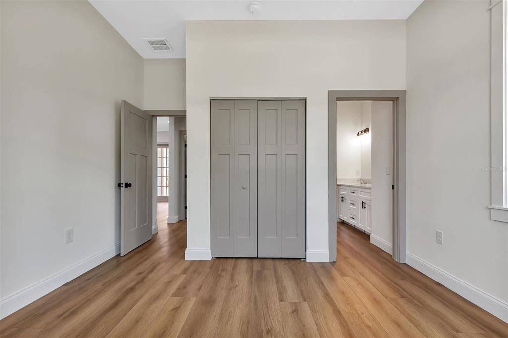 2444 Jacobs Street Port Charlotte, FL 33953 - Photo 35 of 52 a view of a hallway with wooden floor