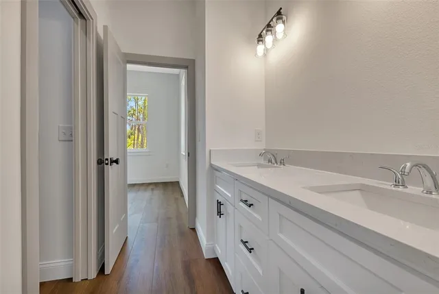 a bathroom with a toilet bathtub and sink