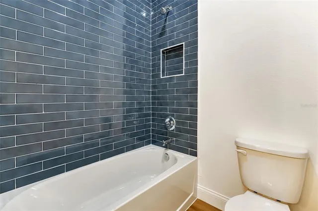 a bathroom with a double vanity sink and a bathtub