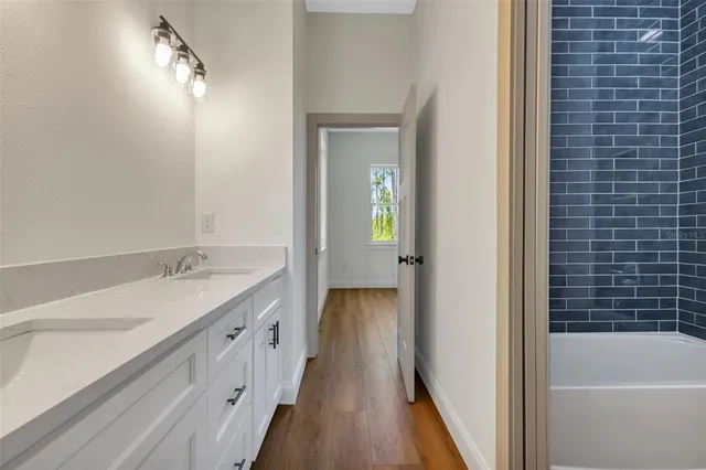 an empty room with closet and wooden floor