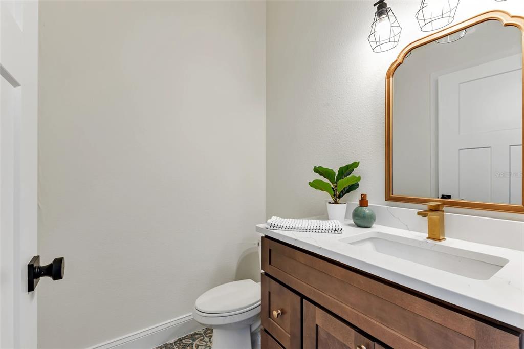 2444 Jacobs Street Port Charlotte, FL 33953 - Photo 42 of 52 a bathroom with a sink a toilet and mirror