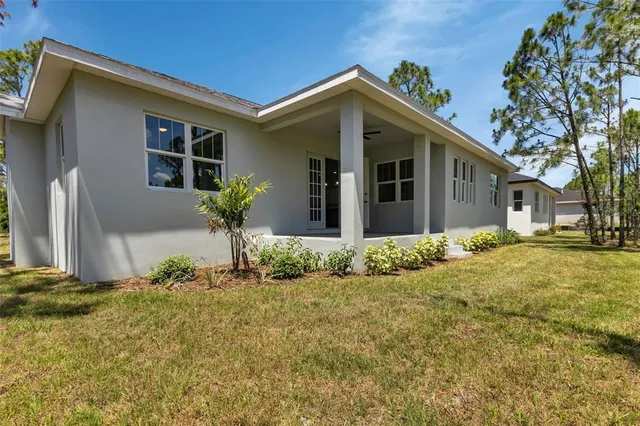 a view of a house with a flower garden