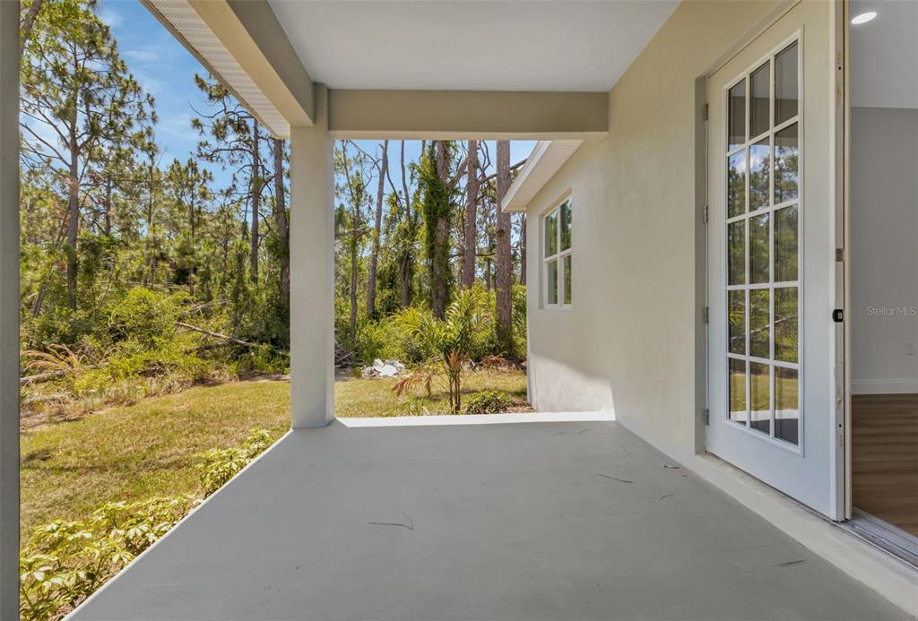 2444 Jacobs Street Port Charlotte, FL 33953 - Photo 49 of 52 a view of a bathroom with a tub and windows