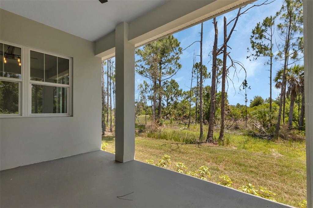 2444 Jacobs Street Port Charlotte, FL 33953 - Photo 50 of 52 a view of a swimming pool with an outdoor space and seating area