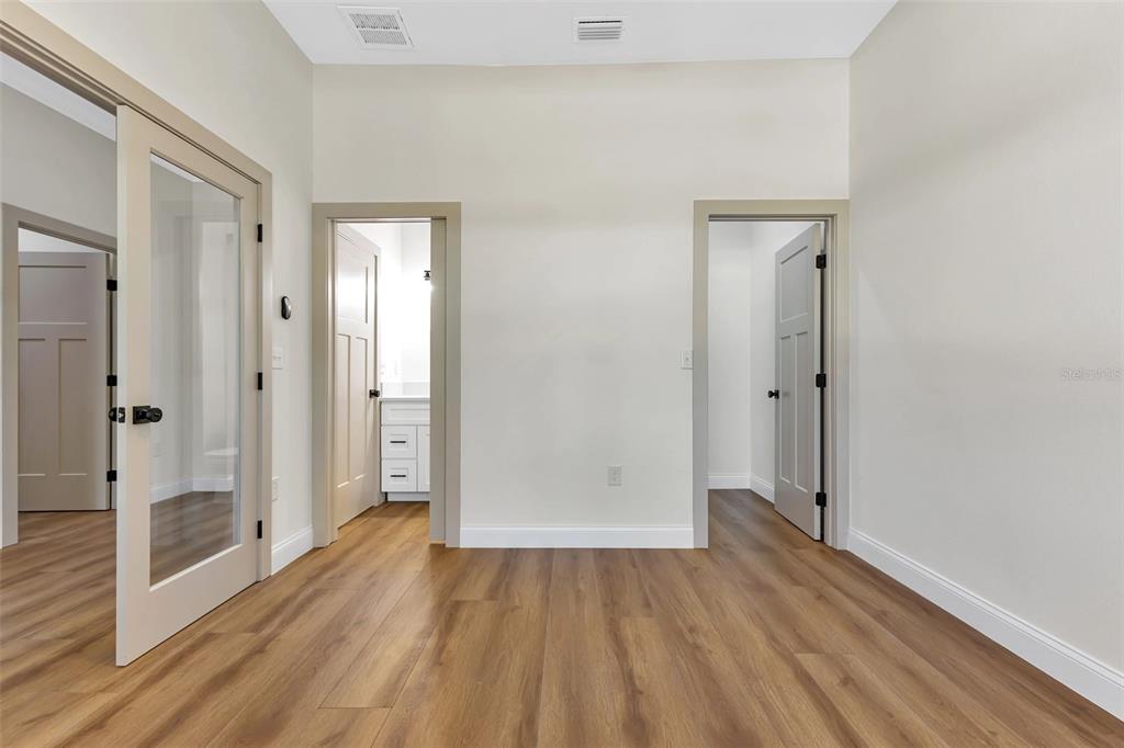 2444 Jacobs Street Port Charlotte, FL 33953 - Photo 9 of 52 wooden floor and closet in a room