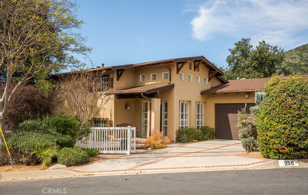 235 Spinks Canyon Road Duarte, CA 91010 - Photo 2 of 62 a front view of a house with a garage