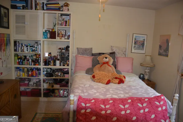 a bedroom with a bed and closet