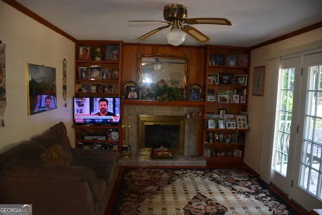 a living room with furniture a rug and a fireplace