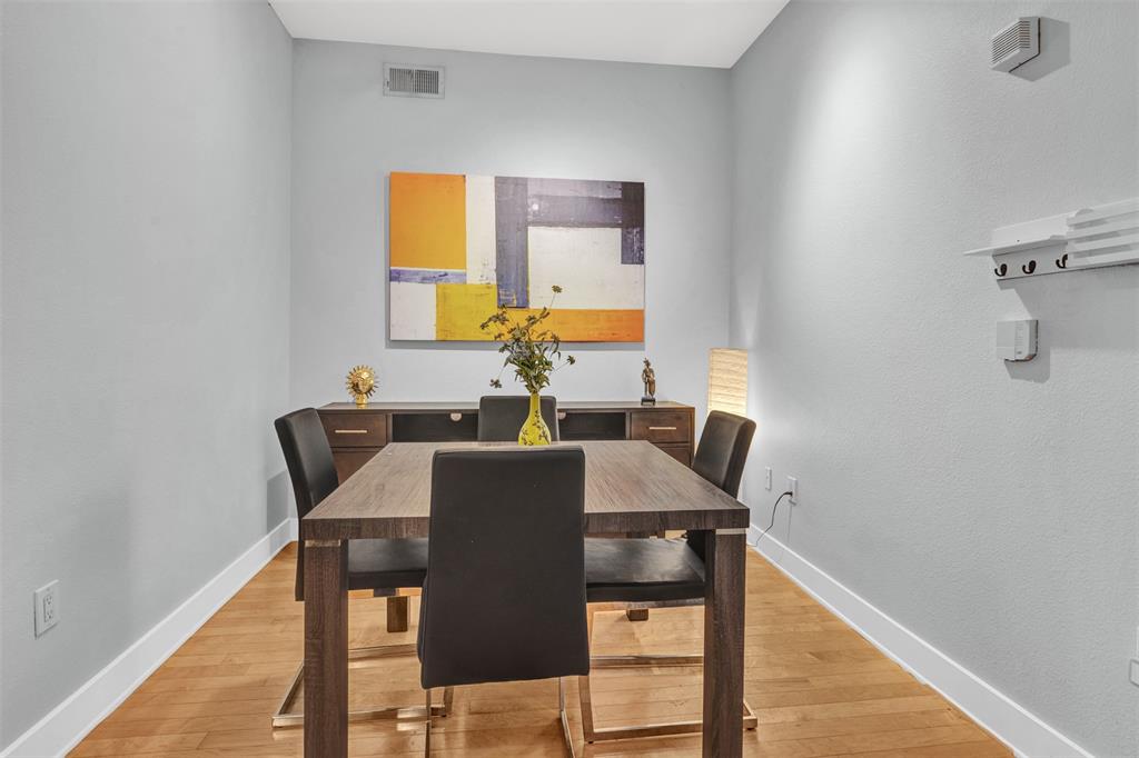 4414 Cedar Springs Road, Unit 314 Dallas, TX 75219 - Photo 5 of 26 a view of a dining room with furniture and a window