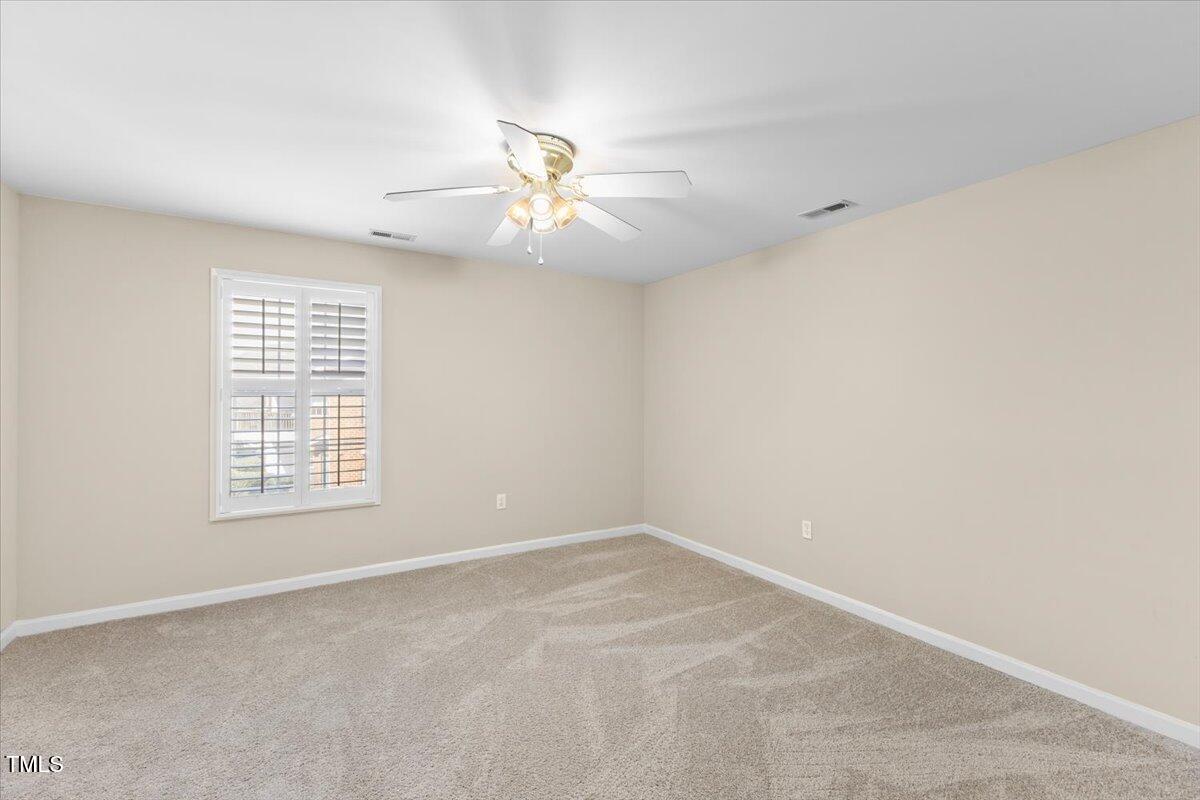723 Renshaw Court Cary, NC 27518 - Photo 24 of 34 a view of an empty room with a window