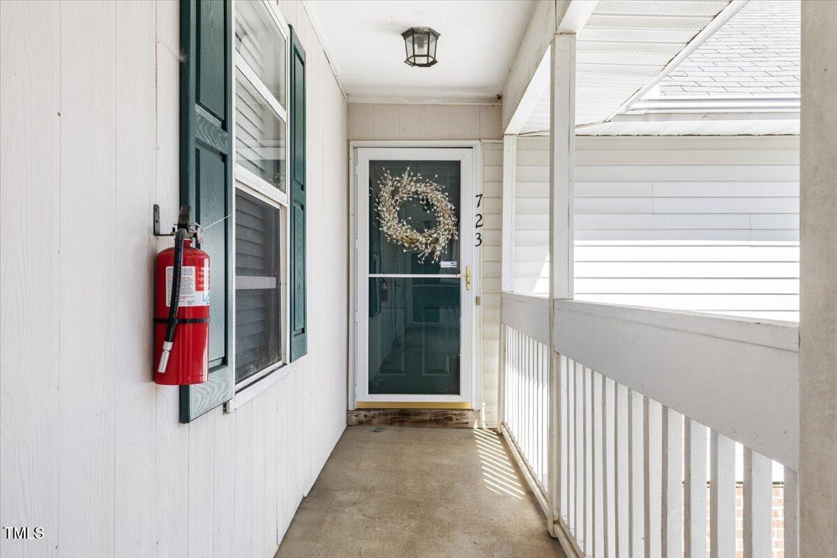 723 Renshaw Court Cary, NC 27518 - Photo 3 of 34 a view of a hallway with windows