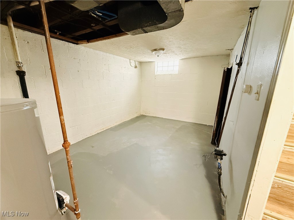 5239 Arch Street Maple Heights, OH 44137 - Photo 18 of 25 Below grade area featuring water heater
