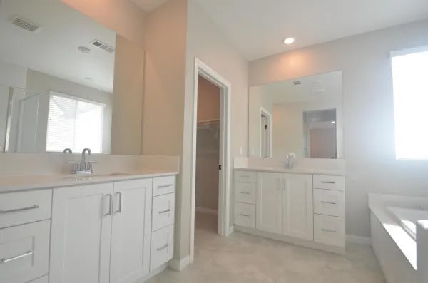 a bathroom with a granite countertop sink mirror and