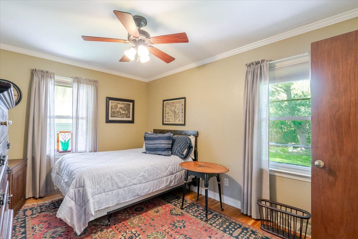 302 Radliff Road Bloomington, IL 61701 - Photo 14 of 35 a bedroom with a bed table and a window