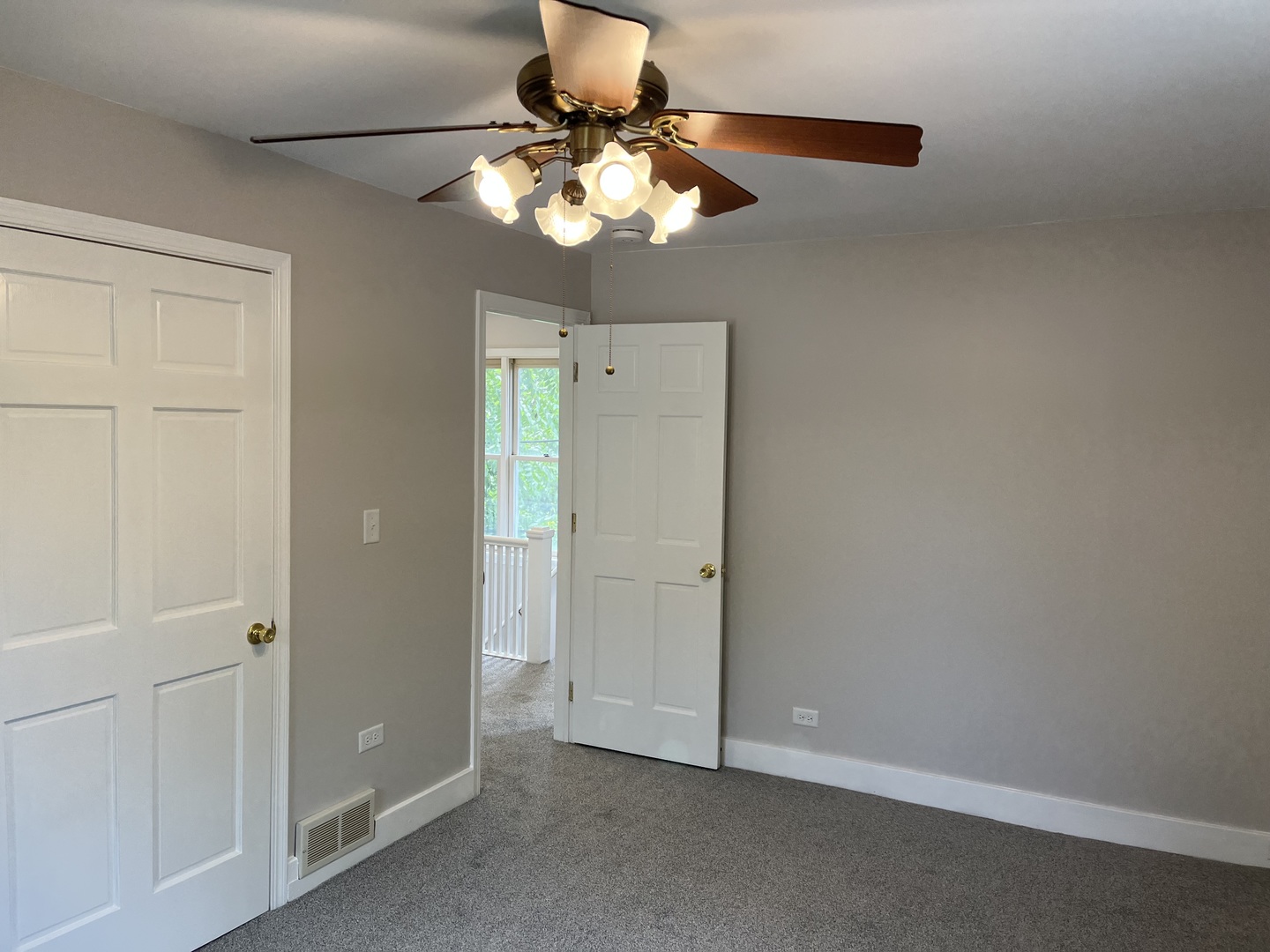 293 Scott Street Lake Forest, IL 60045 - Photo 28 of 30 an empty room with a chandelier fan and a chandelier fan