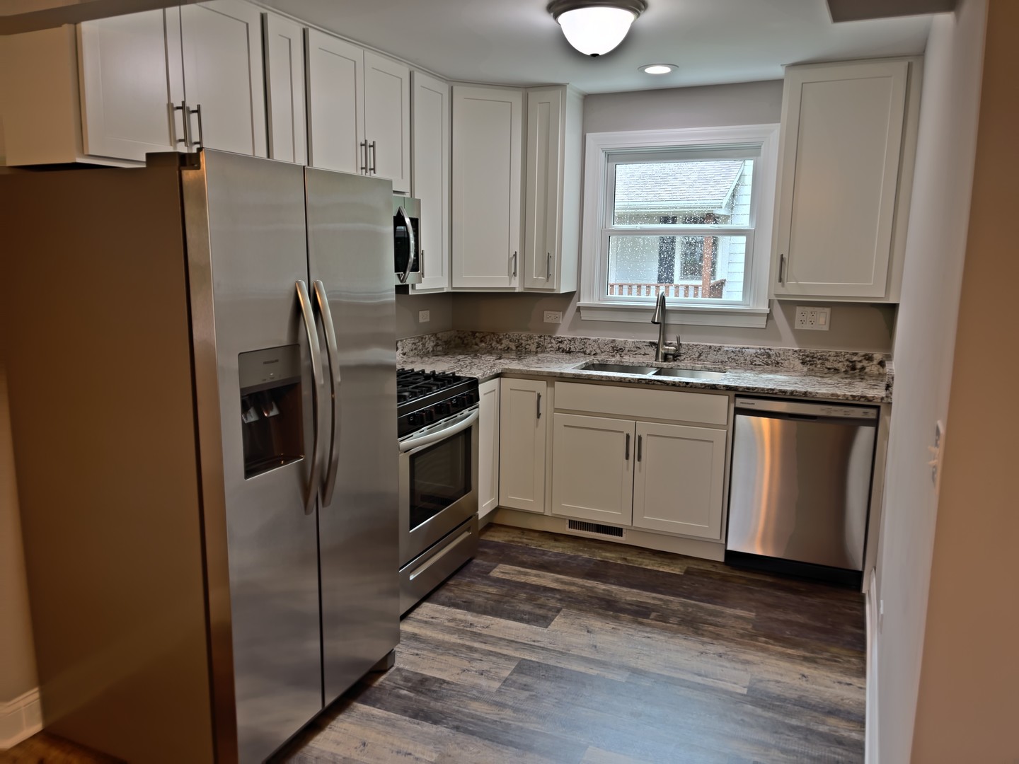 293 Scott Street Lake Forest, IL 60045 - Photo 6 of 30 a kitchen with a sink stove and refrigerator