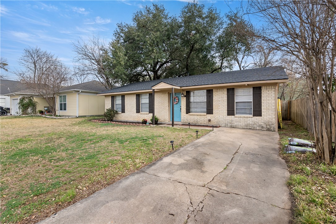 804 East 32nd Street Bryan, TX 77803 - Photo 2 of 22 a front view of a house with a yard