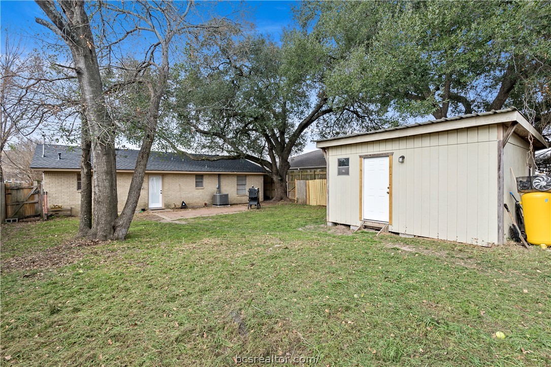 804 East 32nd Street Bryan, TX 77803 - Photo 22 of 22 a view of a house with a back yard