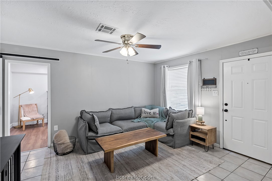 804 East 32nd Street Bryan, TX 77803 - Photo 4 of 22 a living room with furniture and wooden floor