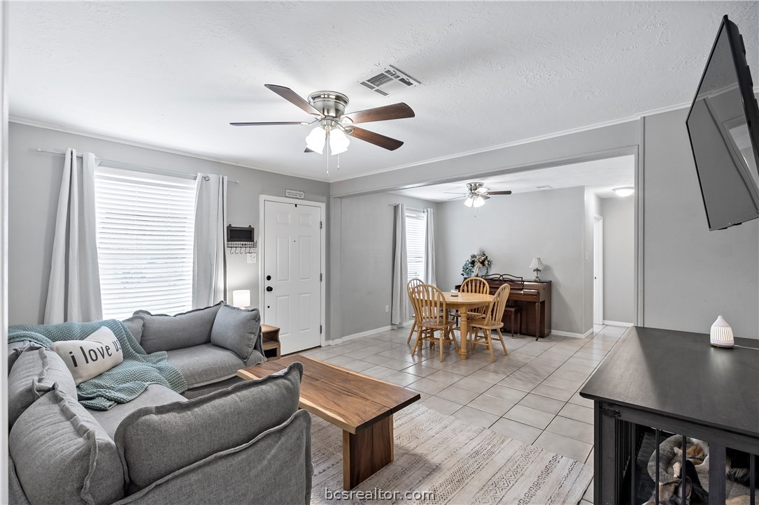 804 East 32nd Street Bryan, TX 77803 - Photo 5 of 22 a living room with furniture a two chairs and a window