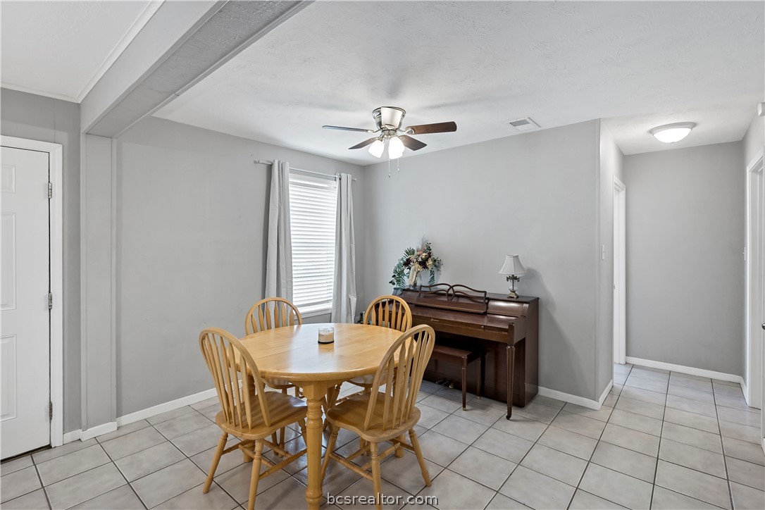 804 East 32nd Street Bryan, TX 77803 - Photo 6 of 22 a view of a dining room with furniture and chandelier