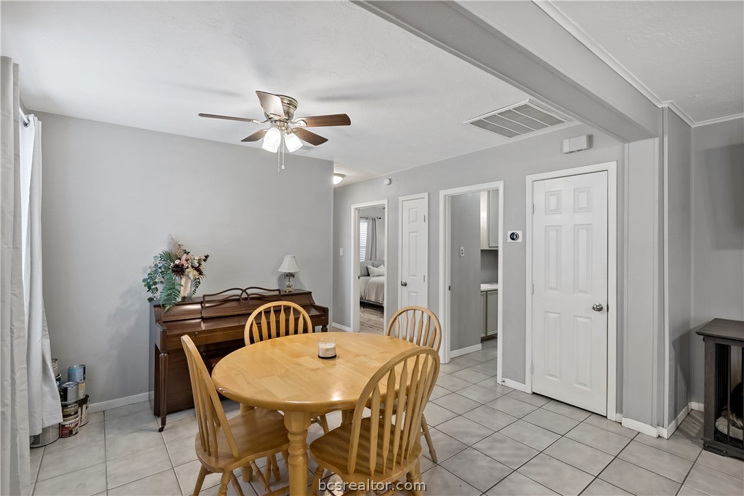 804 East 32nd Street Bryan, TX 77803 - Photo 8 of 22 a view of a dining room with furniture and chandelier
