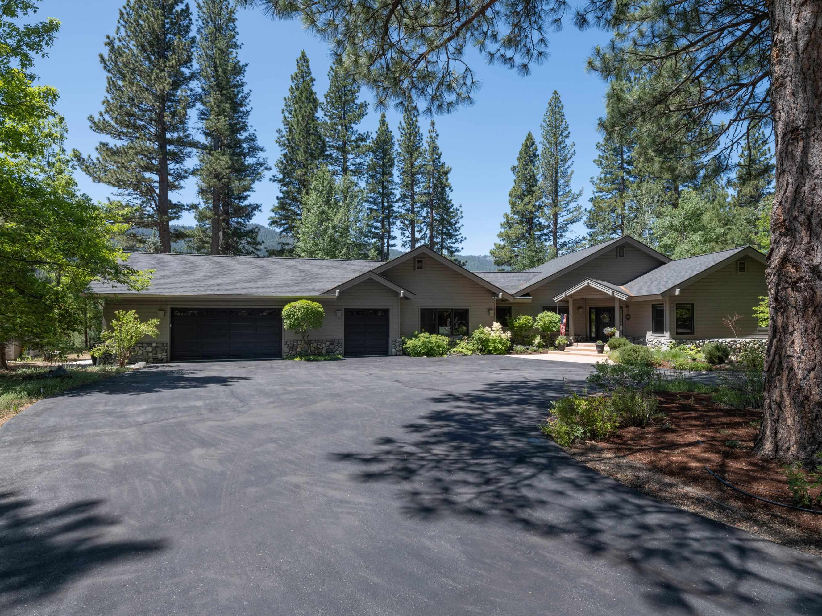 134 Quail View Circle Clio, CA 96106 - Photo 1 of 49 a front view of a house with garden