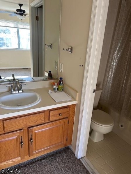 17 Crestmont Road Bedminster, NJ 07921 - Photo 14 of 20 a bathroom with a sink a toilet and a mirror