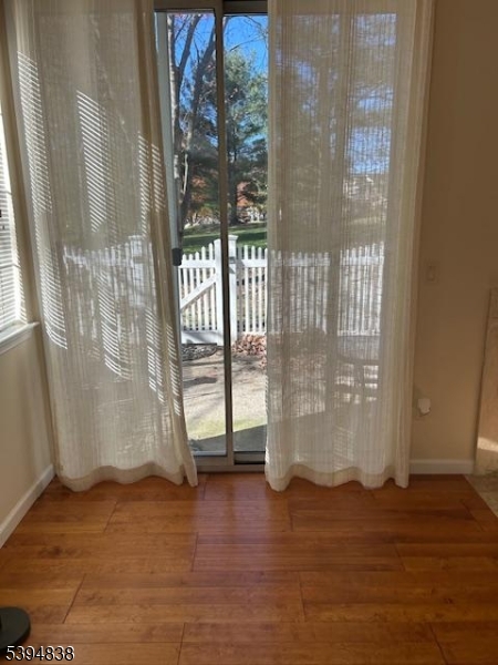 17 Crestmont Road Bedminster, NJ 07921 - Photo 3 of 20 a view of water heater room with wooden floor